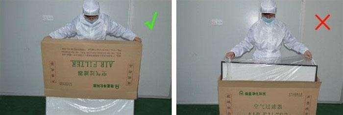 把高效过滤器慢慢倒出来，把纸箱放一边查看高效过滤器是否损坏